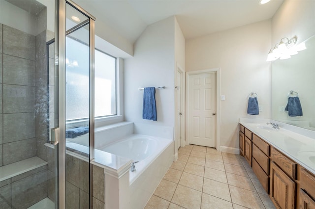 bathroom with tile patterned flooring, vanity, and separate shower and tub