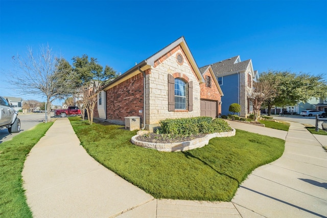 view of side of home with a yard