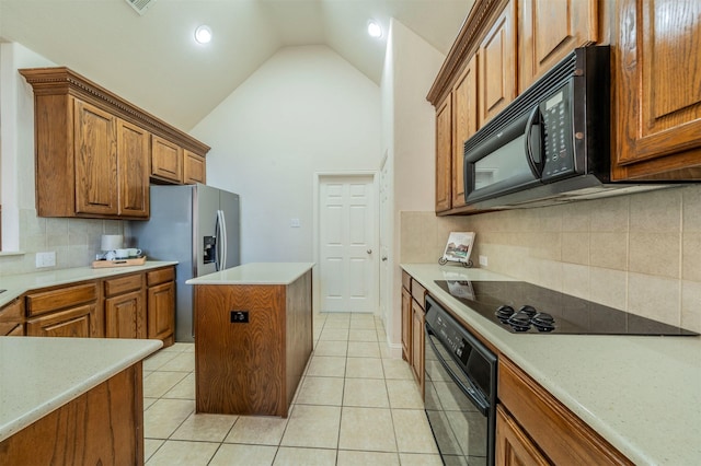 kitchen featuring high vaulted ceiling, a center island, tasteful backsplash, black appliances, and light tile patterned flooring