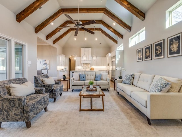 carpeted living room with high vaulted ceiling and beam ceiling