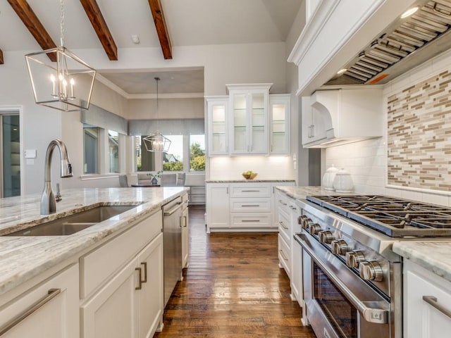 kitchen featuring sink, premium range hood, white cabinets, backsplash, and stainless steel appliances