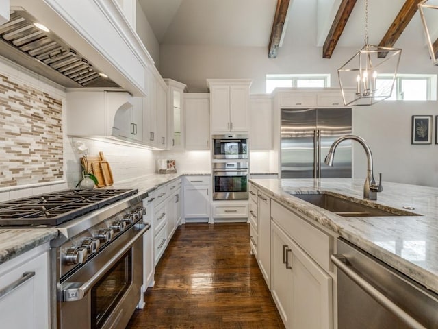 kitchen with custom exhaust hood, premium appliances, tasteful backsplash, sink, and white cabinets