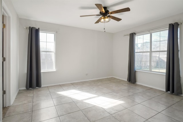 unfurnished room featuring ceiling fan and light tile patterned floors