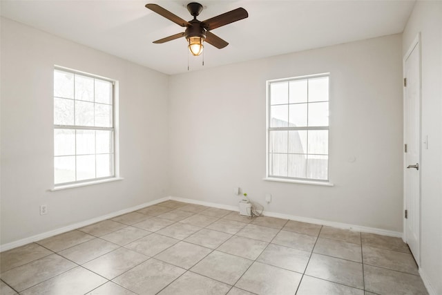 unfurnished room with light tile patterned floors and ceiling fan