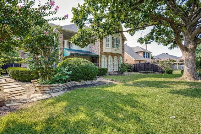 view of yard with a balcony