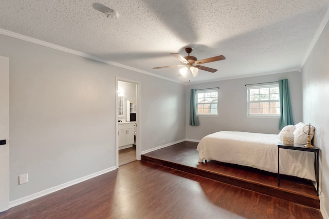 bedroom featuring dark hardwood / wood-style flooring, crown molding, and a textured ceiling