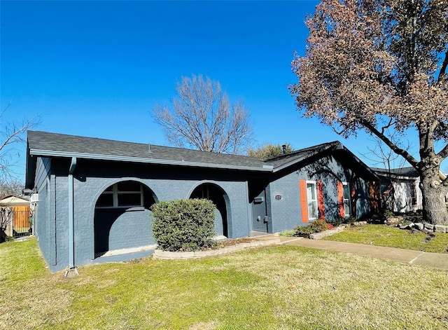 ranch-style house with a front lawn