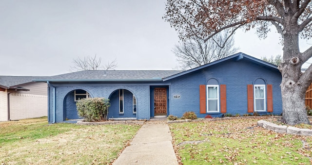 ranch-style house with a front lawn