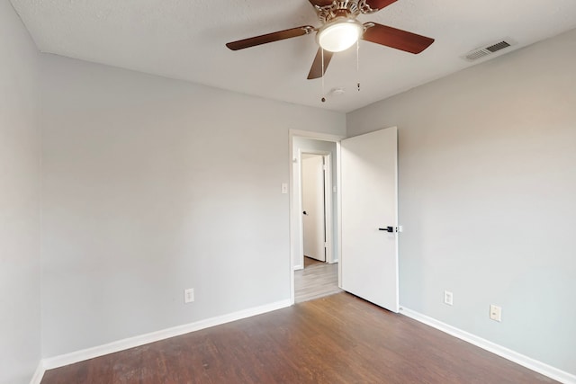 1721 Melrose St, Garland, TX 75042 - unfurnished room with baseboards, wood finished floors, visible vents, and ceiling fan