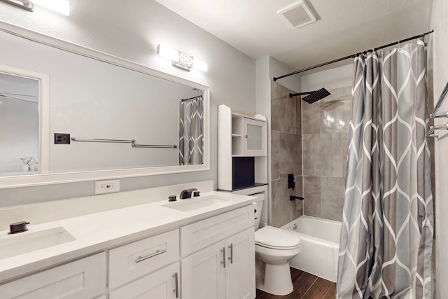 1721 Melrose St, Garland, TX 75042 - full bath with double vanity, wood finished floors, and shower / tub combo