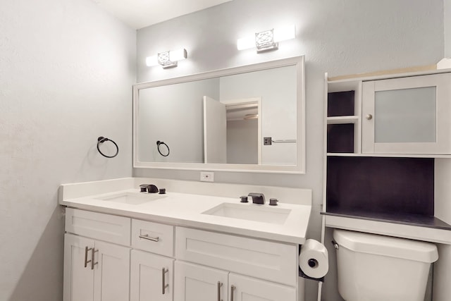 1721 Melrose St, Garland, TX 75042 - bathroom featuring double vanity and toilet