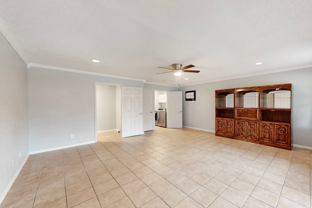 tiled empty room featuring crown molding, a textured ceiling, independent washer and dryer, and ceiling fan