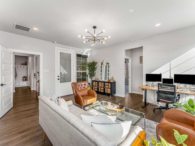 living room with dark hardwood / wood-style flooring and a chandelier