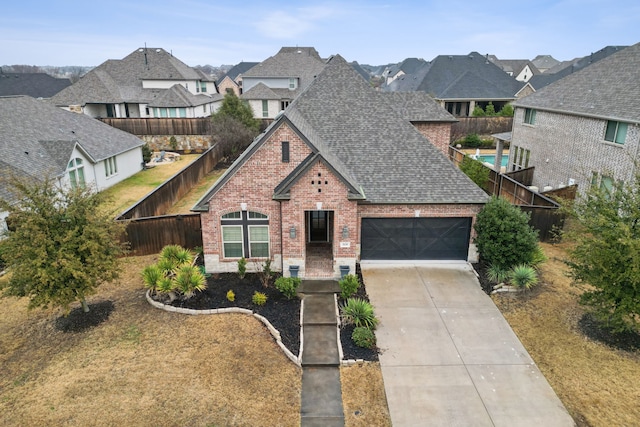 view of front facade with a garage and a front yard