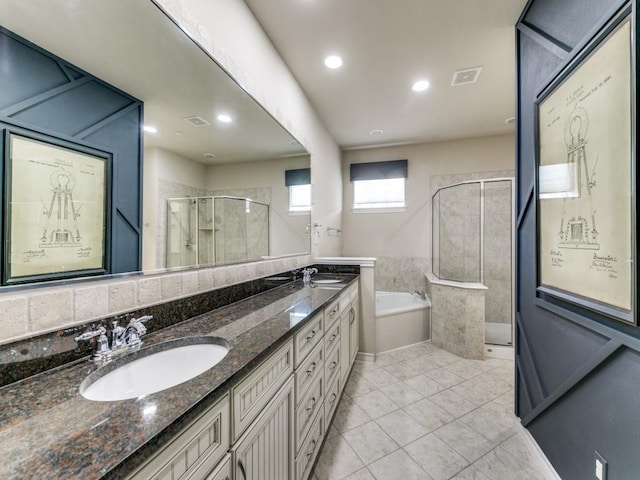 bathroom with separate shower and tub, tile patterned floors, and vanity