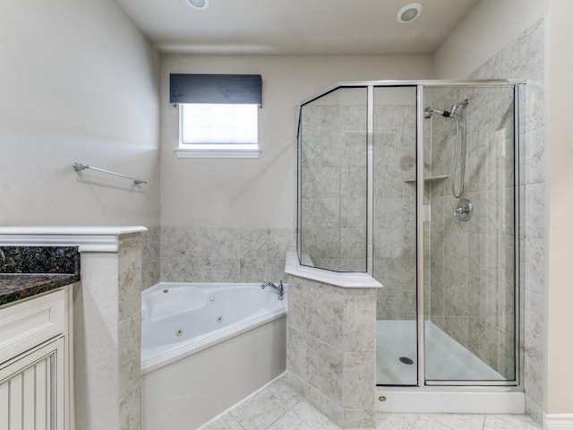 bathroom with independent shower and bath and vanity