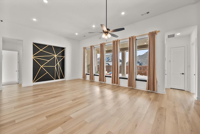 spare room featuring ceiling fan and light hardwood / wood-style flooring