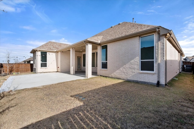 rear view of property featuring a patio area