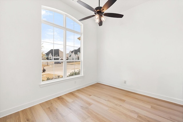 unfurnished room featuring ceiling fan and light wood-type flooring