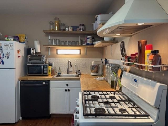 kitchen featuring sink, white cabinetry, island range hood, wooden counters, and black appliances