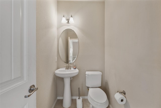 bathroom with tile patterned floors and toilet