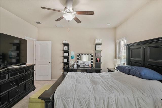 bedroom featuring light carpet and ceiling fan