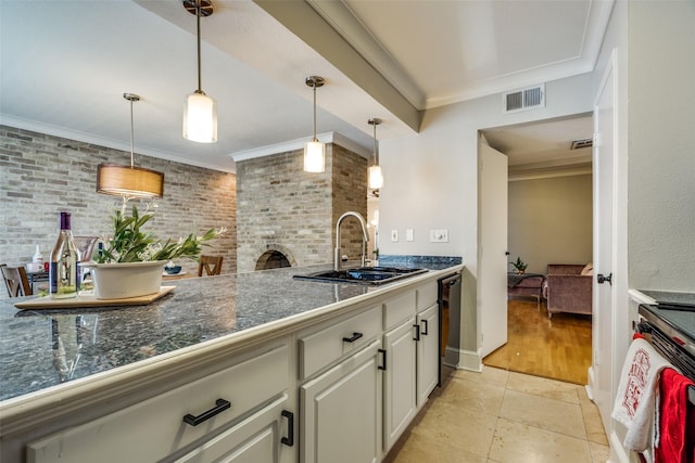 kitchen featuring range with electric stovetop, decorative light fixtures, black dishwasher, sink, and ornamental molding