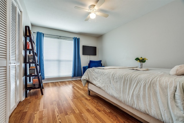 bedroom with ceiling fan and hardwood / wood-style floors