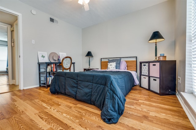 bedroom featuring ceiling fan and light hardwood / wood-style flooring