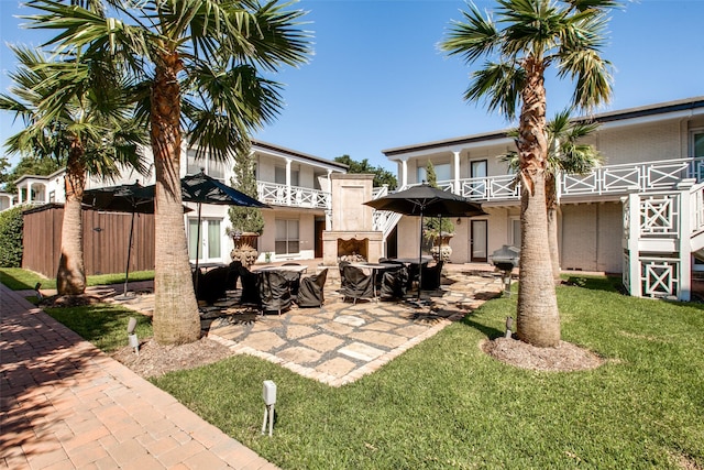 exterior space with a balcony and a grill