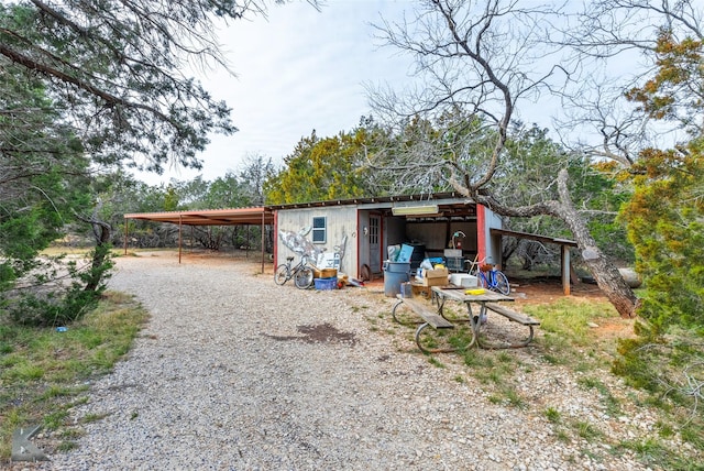 view of outdoor structure with a carport