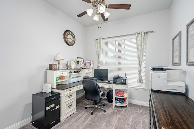 office space featuring plenty of natural light, carpet flooring, and ceiling fan