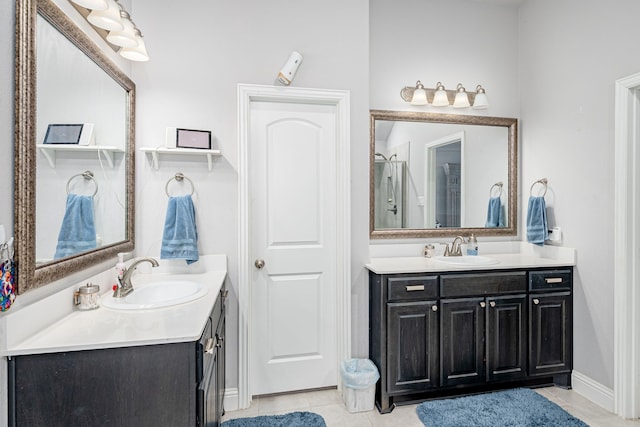 bathroom featuring a shower, tile patterned floors, and vanity