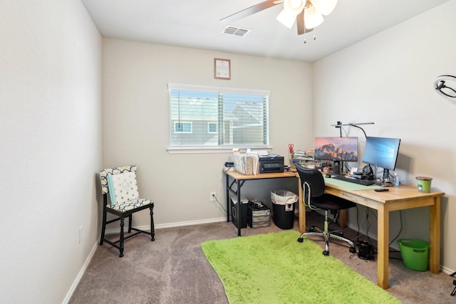 office space featuring ceiling fan and carpet