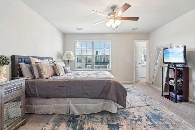 carpeted bedroom with ceiling fan