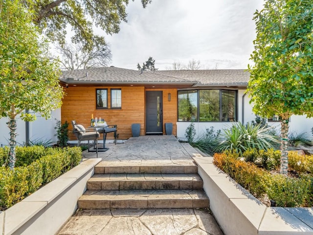 view of front of home with a patio area