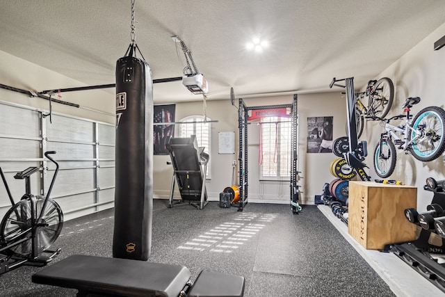 workout area with a textured ceiling