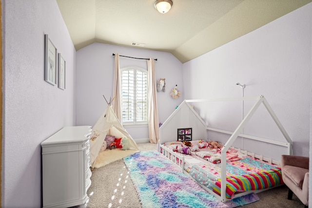 carpeted bedroom featuring vaulted ceiling