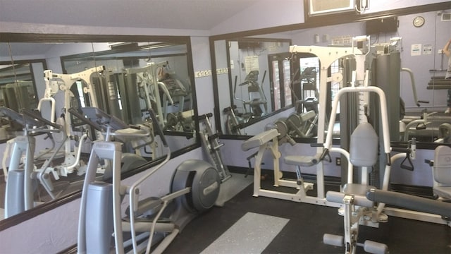 exercise room with lofted ceiling