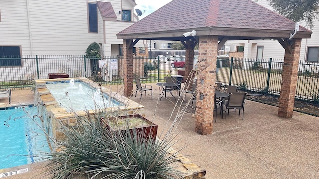 view of pool with a gazebo, a jacuzzi, and a patio area