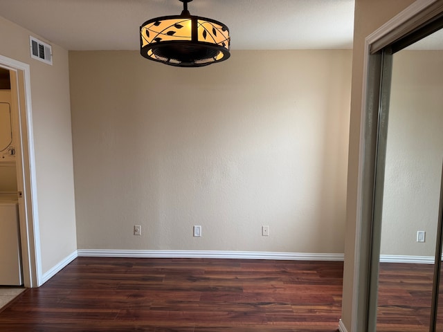 unfurnished dining area featuring dark hardwood / wood-style flooring