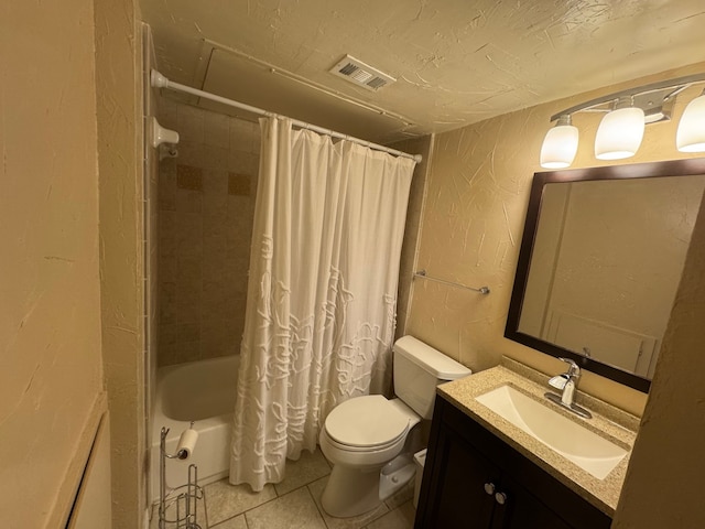 full bathroom featuring tile patterned floors, toilet, a textured ceiling, vanity, and shower / bath combination with curtain