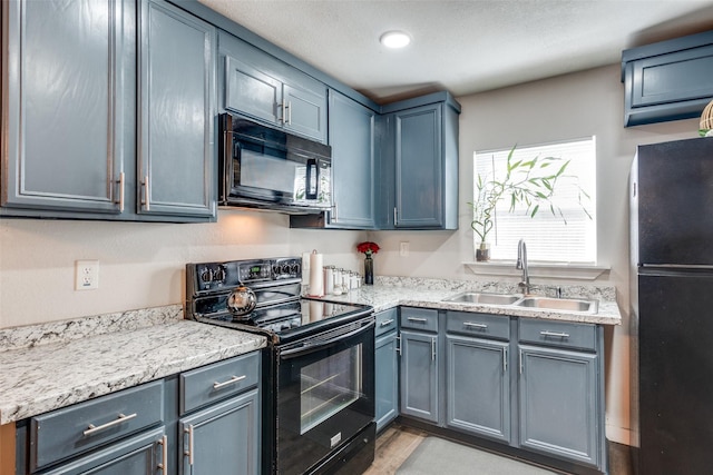 kitchen featuring sink and black appliances