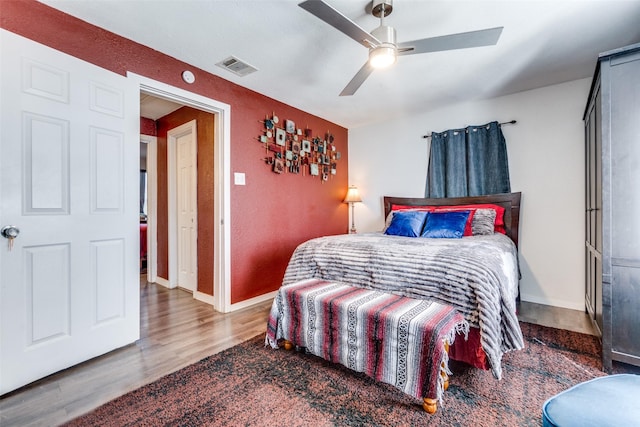 bedroom featuring hardwood / wood-style flooring and ceiling fan