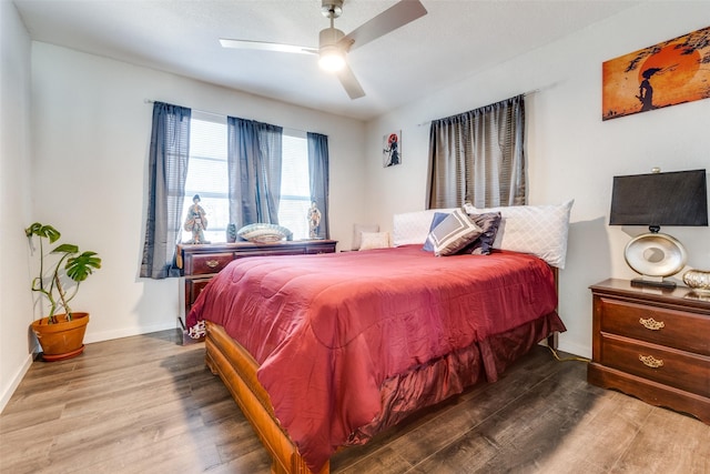 bedroom featuring wood-type flooring and ceiling fan