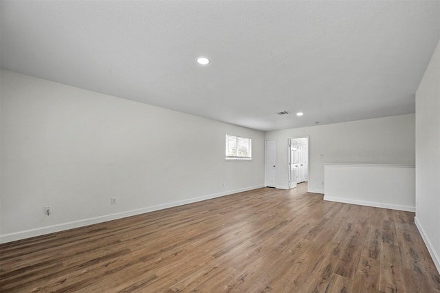 spare room featuring hardwood / wood-style flooring