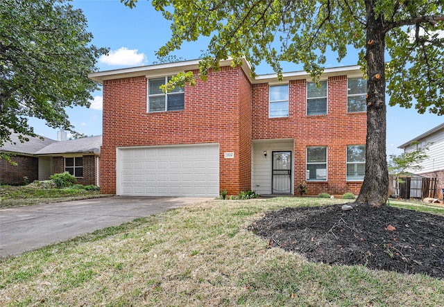 view of front of property featuring a garage and a front yard