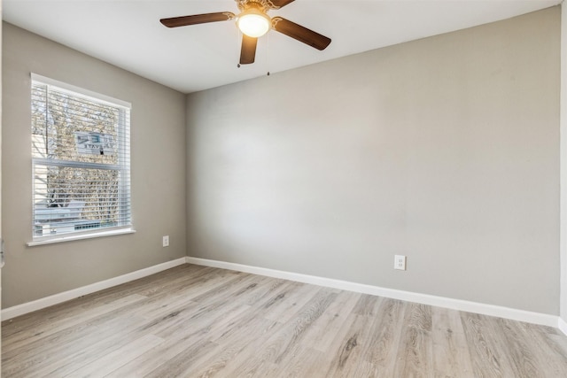 spare room featuring light hardwood / wood-style floors and ceiling fan