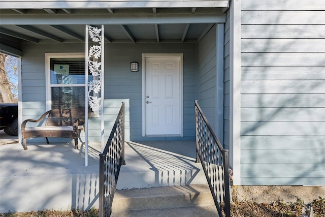 entrance to property with covered porch