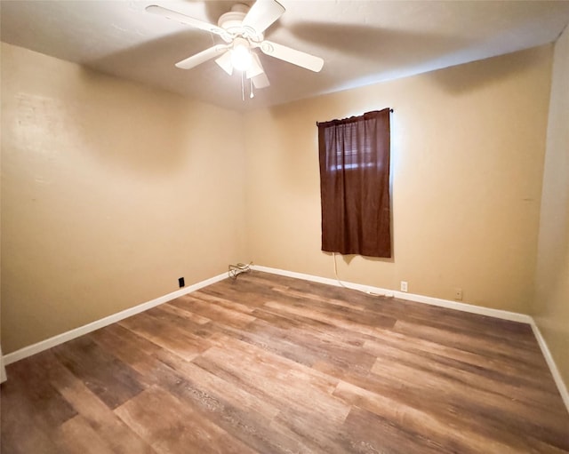 unfurnished room featuring hardwood / wood-style floors and ceiling fan